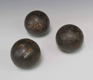 Three canon balls 9cm diam. 