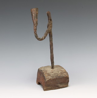 A 17th/18th Century wrought iron rush light holder, raised on an oak base 29cm h x 10cm 