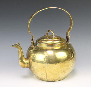 An 18th Century circular brass kettle with swing handle 29cm h x 18cm 