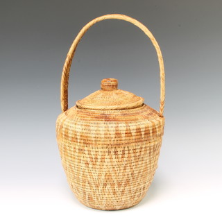 An African style circular basket with cover 43cm h x 20cm diam. 