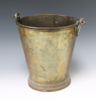 A 19th Century waisted brass pail with polished steel handle marked MP 30cm h x 29cm diam. 