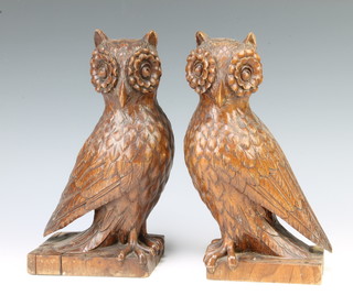 A pair of Continental carved wooden figures of seated owls 28cm h x 13cm w x 8cm d 
