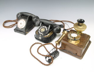 A Belgium Bell telephone, a metal telephone marked Belgique Bell telephone MFG Company, a Bakelite black dial telephone marked P.T.T. appareil model BC1 together with a wall mounted telephone 