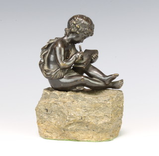 After the antique, a bronze figure of a reclining scholarly cherub raised on a rocky outcrop 16cm x 10cm x 6cm 