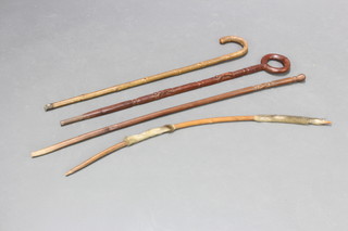 An African carved hardwood walking stick, 2 other walking sticks and bow 