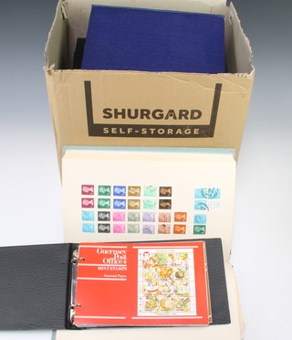 A stock book of Elisabeth II GB and Commonwealth mint and used stamps together with 20 albums of presentation mint Channel Islands stamps 