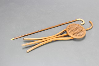 A walking cane with turned horn handle and a bentwood shooting stick with woven cane seat (crack to rim)
