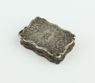 A Victorian chased silver rectangular vinaigrette with scroll decoration and floral gilt grill, Birmingham 1868, 3cm 