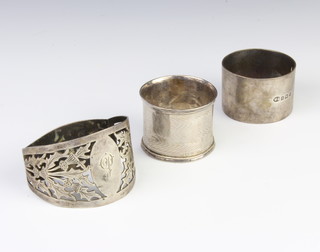 A pierced silver napkin ring Sheffield 1925 and 2 others, 72 grams