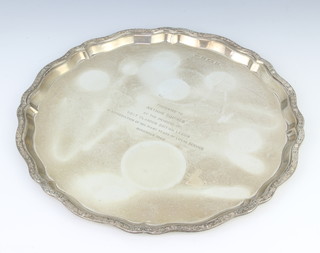 A silver salver with Cymric border and presentation inscription Birmingham 1965, 456 grams 25cm 