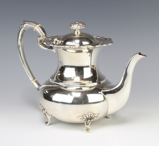 A silver baluster coffee pot with shell decoration on scroll feet, Sheffield 1977, 798 grams gross 