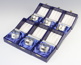 Six engine turned silver napkin rings, Birmingham 1990, 156 grams, all individually boxed  