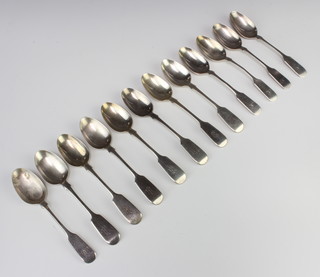 A matched set of 12 fiddle pattern silver teaspoons, mixed dates, 266 grams