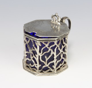 A Victorian silver pierced octagonal mustard with rustic decoration and chased scrolls London 1846, maker Charles Thomas Fox and George Fox, with blue glass liner, 146 grams, 6cm 