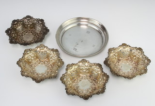A set of 4 Edwardian repousse silver bon bon dishes with floral decoration, Birmingham 1901 and a silver nut dish 141 grams 