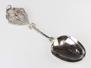 A Continental silver spoon with fancy cast handle, import marks London 1892, 199 grams 