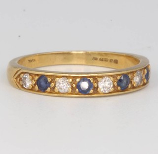 An 18ct yellow gold sapphire and diamond half hoop ring size O 