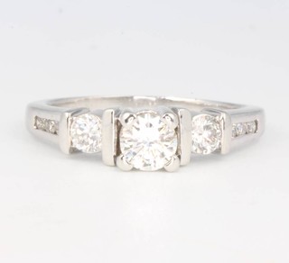 A 14ct white gold diamond ring with diamond shoulders 1.1ct, size P 1/2