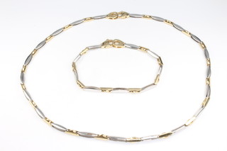 A 9ct 2 colour gold necklace 42cm, an ensuite bracelet 19cm, 20 grams