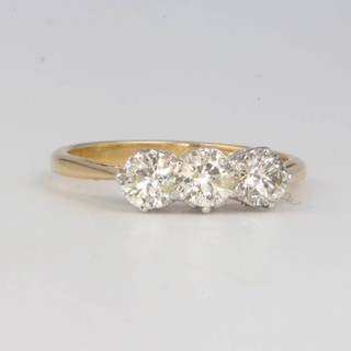 An 18ct yellow gold 3 stone diamond ring approx. 1.6ct size O 1/2