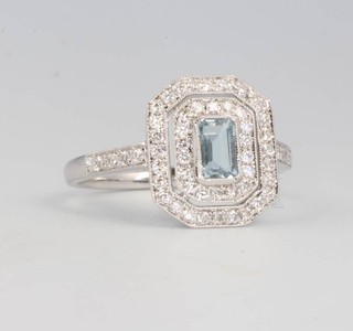 An 18ct white gold Art Deco style aquamarine and diamond cluster ring size M 1/2 
