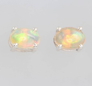 A pair of oval opal ear studs 