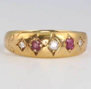 An 18ct yellow gold diamond and ruby ring size M 1/2 