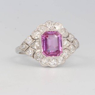 A platinum pink sapphire and diamond cluster ring size N 