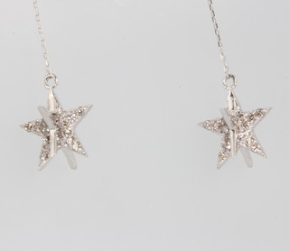 A pair of 18ct white gold diamond star drop earrings 