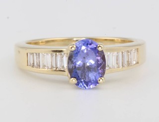 A 14ct yellow gold tanzanite and diamond ring, the oval cut centre stone approx. 1.5ct 