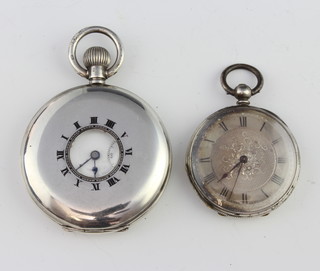 A silver half hunter pocket watch with seconds at 6 o'clock and an Edwardian silver key wind fob watch with champagne dial 