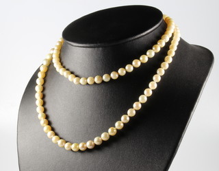 A strand of cultured pearls with a 9ct and pearl set clasp 76cm 