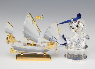 A Swarovski Crystal Kris Bear 2007 sitting on a drum 905208/9400000136 by Heinz Tabertshofer 3cm and Journeys Chinese Junk 272708/9461000015 2001 boxed