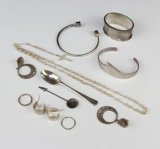 A silver bangle and minor silver jewellery 100 grams