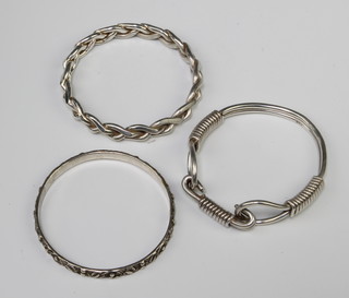 A silver bangle, 2 others, 138 grams 
