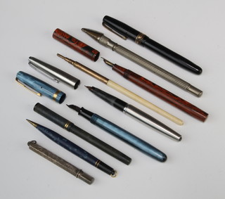 A Waterman's marble blue fountain pen with 14ct nib, a red marbled Spot fountain pen, a black Waterman's do. and a Conway Stewart fountain pen, 5 pens and pencils