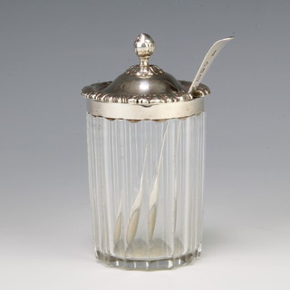 A George IV silver mounted glass condiment with spoon Birmingham 1824
