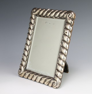A silver photograph frame with bevel plate 21cm x 16cm 