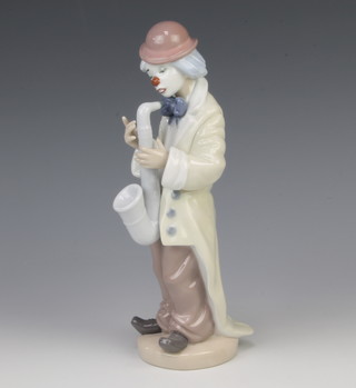 A Lladro figure of a clown playing a saxophone 5471 23cm 