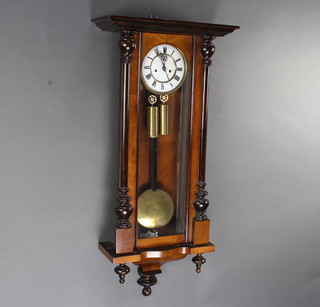 A 19th Century striking regulator with 16cm enamelled dial, subsidiary second hand contained in a walnut case 