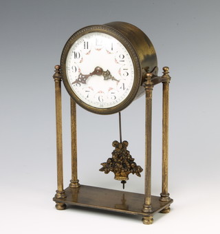 An Edwardian French Empire style Portico clock with enamelled dial Arabic numerals contained in a gilt metal case, raised on turned and fluted columns 22cm x 13cm x 6cm 