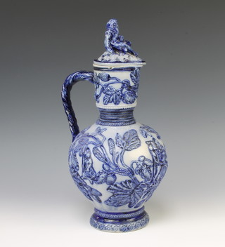 A German blue glazed jug and lid decorated with figures 37cm 