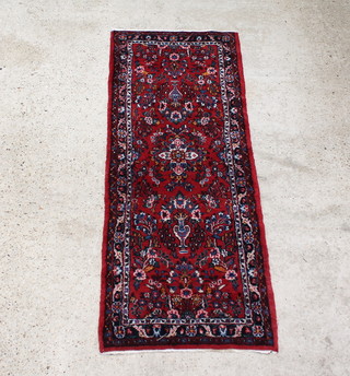 A red and floral ground Persian Mehraban runner 203 x 74cm 
