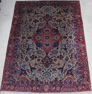 A Persian blue and red ground floral patterned carpet with central medallion 364cm x 270cm  