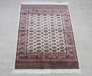 A white and red ground Belgian cotton Bokhara style rug with numerous octagons to the centre 190c x 140cm 