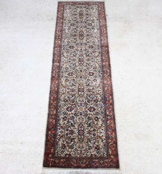 A white ground and floral patterned Bidjar runner 301cm x 85cm 