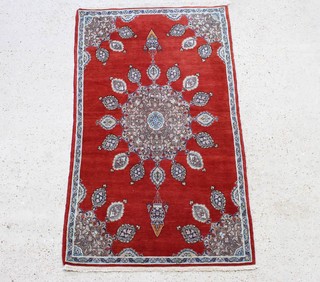 A tan and blue ground Persian Tabriz rug with central medallion and mosque lamp decoration 164cm x 91cm
