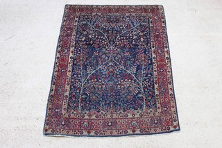 A blue and floral ground Persian Tabriz rug 186cm x 138cm (in wear) 