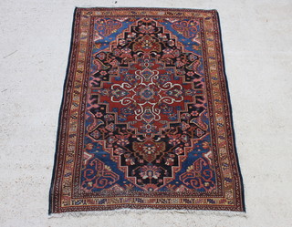 A blue and tan ground Persian Bakhtiari rug with central medallion 201 x 142cm 