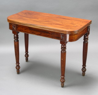 A 19th Century plum pudding mahogany D shaped tea table, raised on turned supports 72cm h x 92cm w x 45cm d 